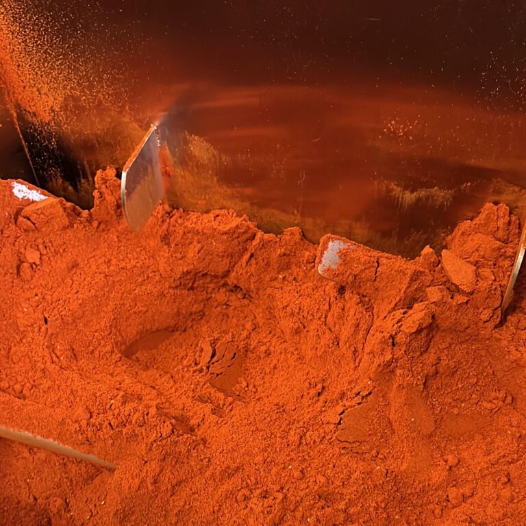 sungrown harvests pepper powder mixing in stainless steel container